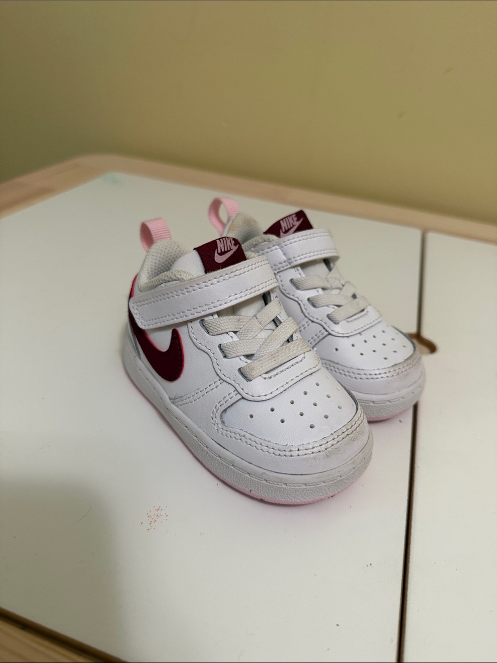 Nike Kids White Sneakers with Burgundy Swoosh and Pink Accents